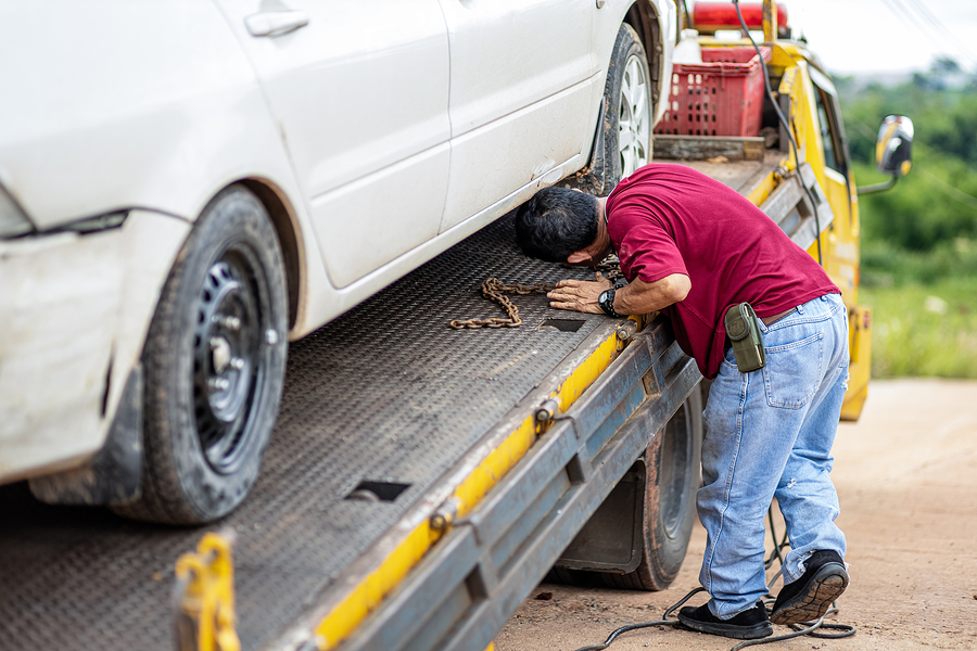 man inspecting the car